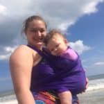 baby in water wrap with mom