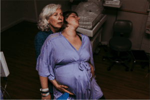 birth doula supporting mom in labor