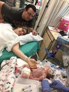 mother reaching out to infant Edison