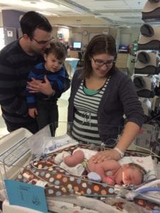 family looking at Edison