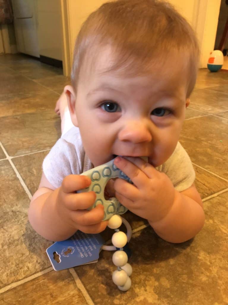 baby chewing on teether