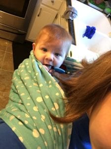 baby on back with necklace