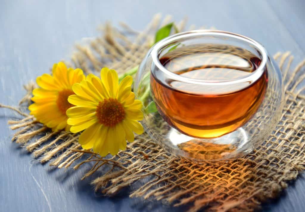 cup of warming tea for mom with flowers