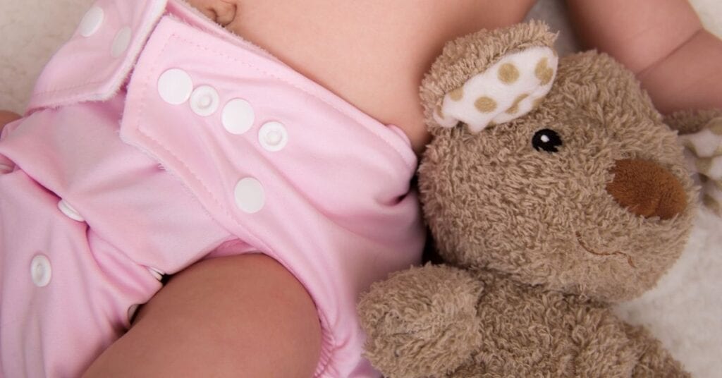 baby wearing cloth diapers, best way to save on diapers